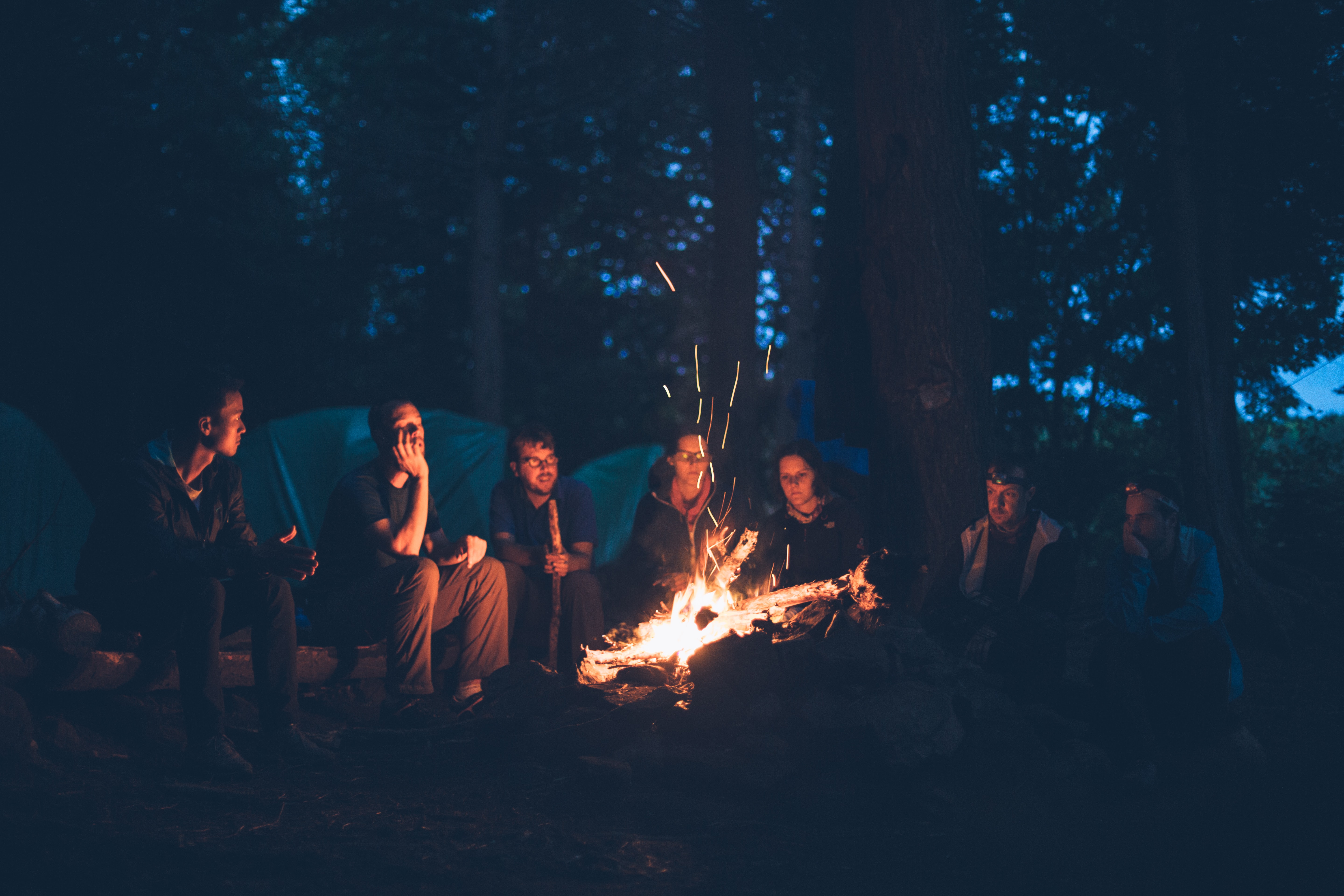 people around a camp fire