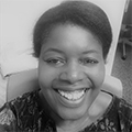 black and white head shot of Sharon McKoy