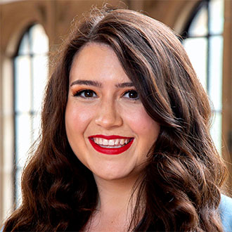 person with long wavy hair somining