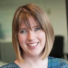 colour head shot photo of a woman smiling