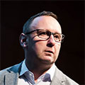 colour head and shoulders shot of a man in glasses