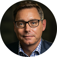 person wearing glasses looking at the camera