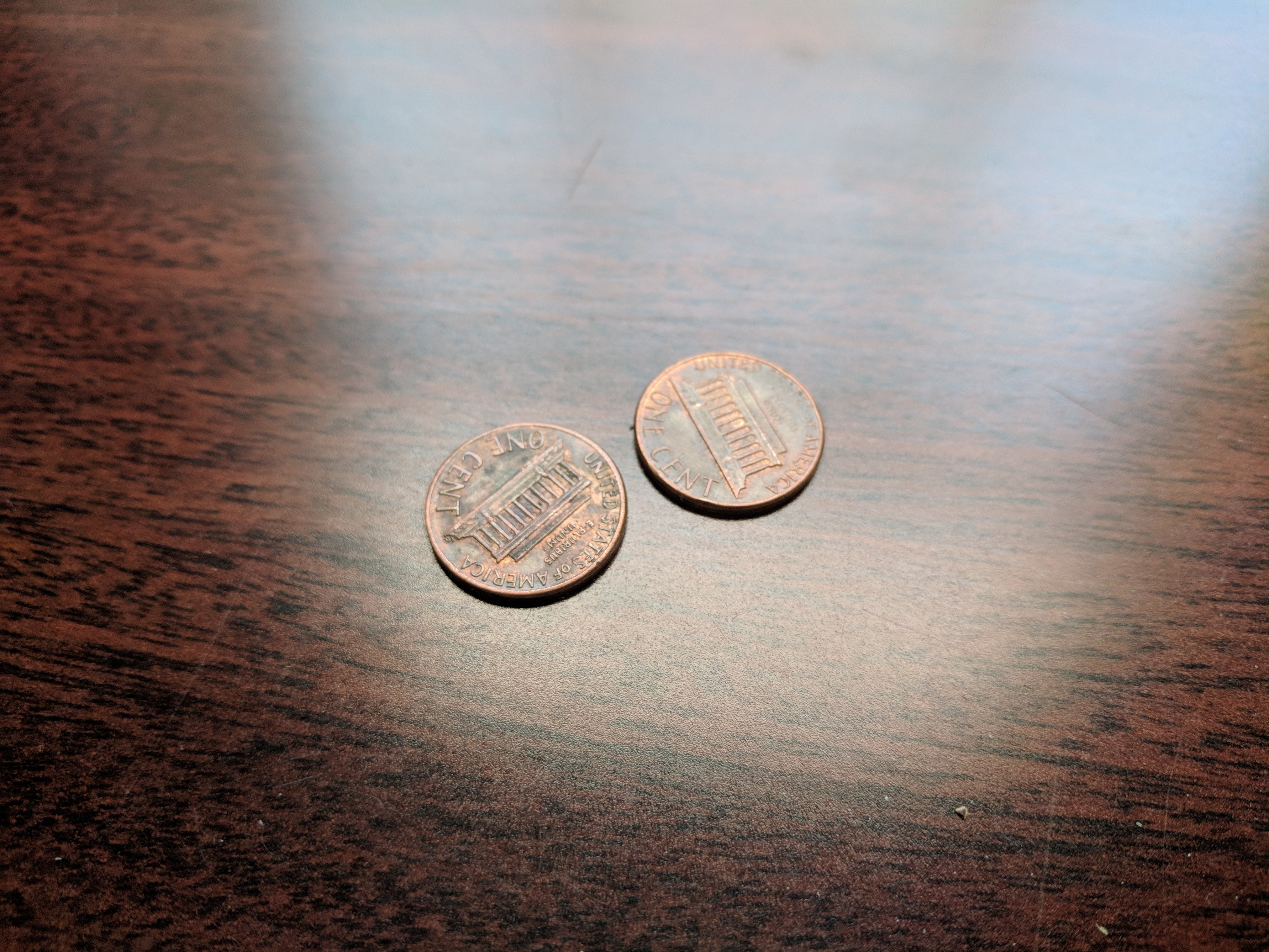 Colour photograph of two cents on a table