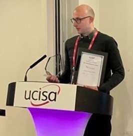 person stood at a lectern 