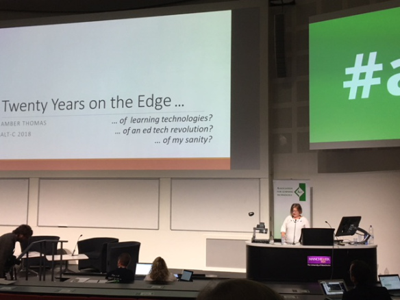 Colour photograph of Amber Thomas presenting at ALTC on her twenty years on the edge